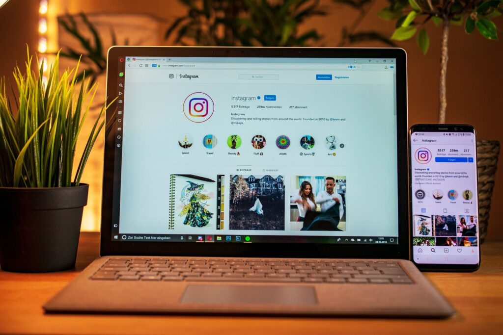 Instagram on laptop and mobile screens