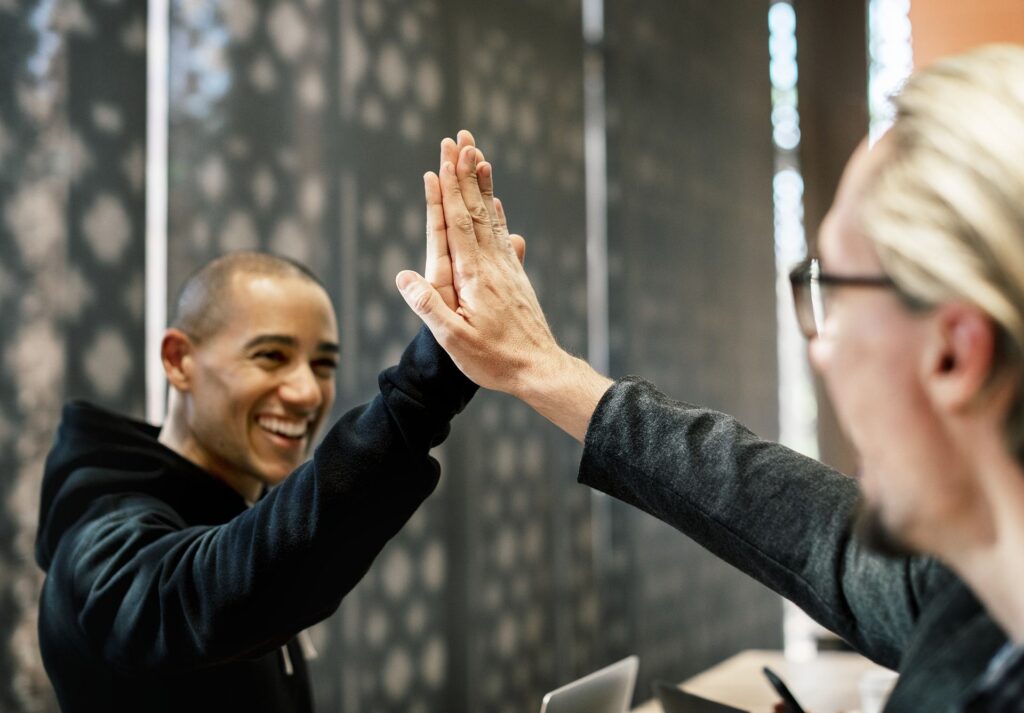 Two people high-fiving