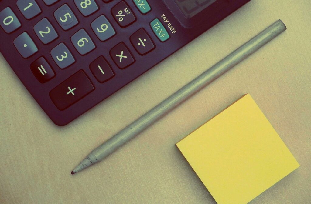 Calculator, pen and post-it notes